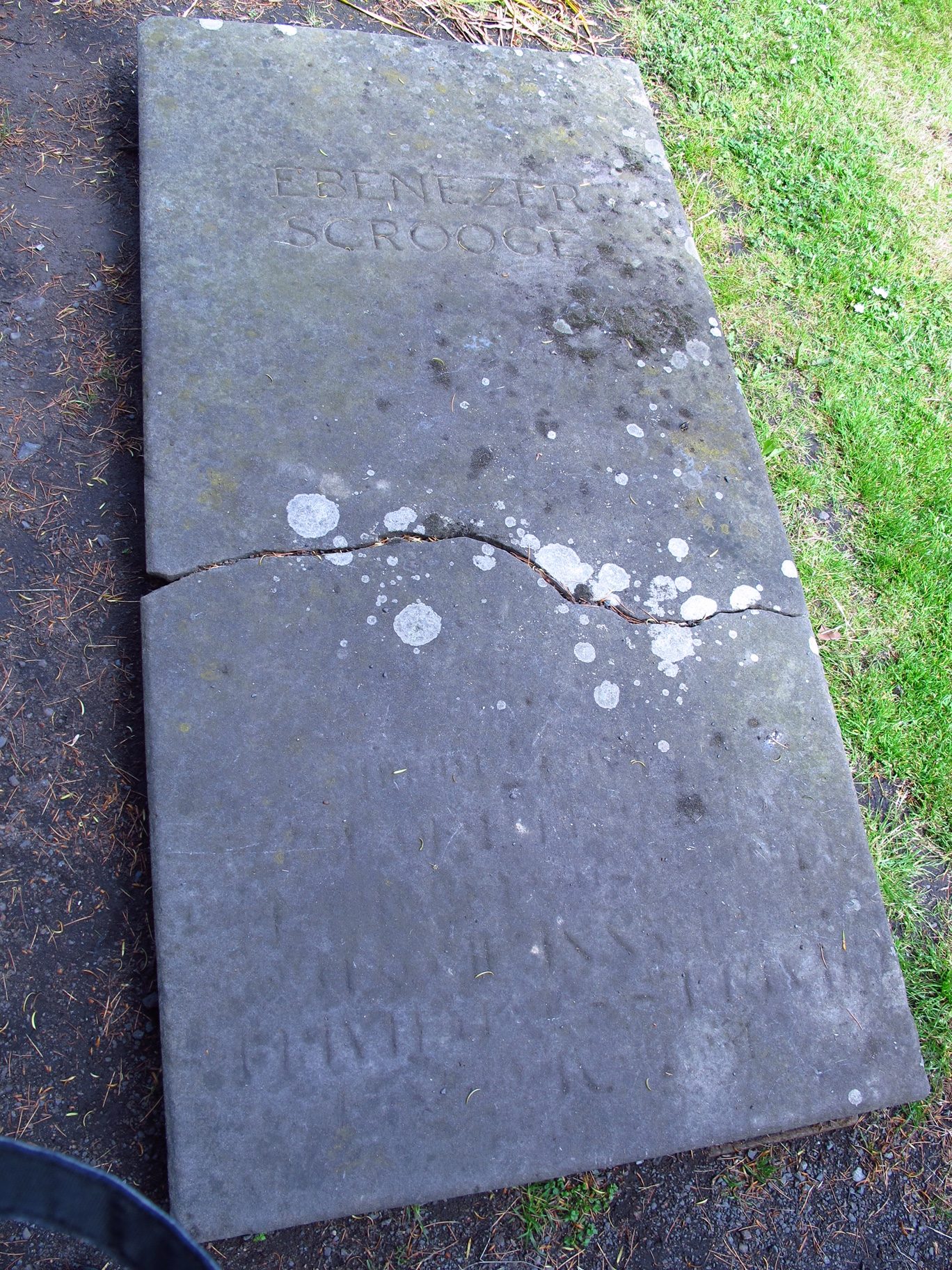 Let There be Light: Ebenezer Scrooge's Gravestone.