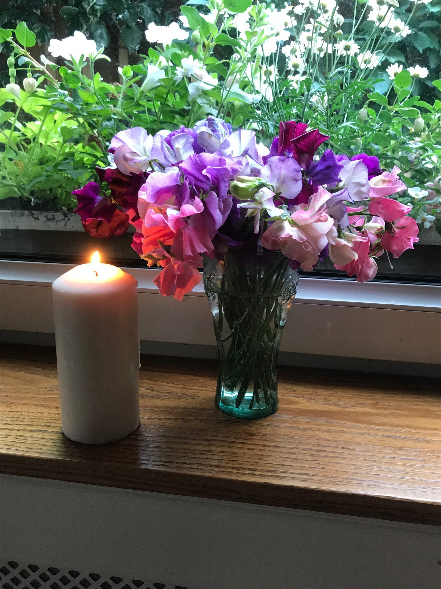 Heatwave: Candle and flowers.