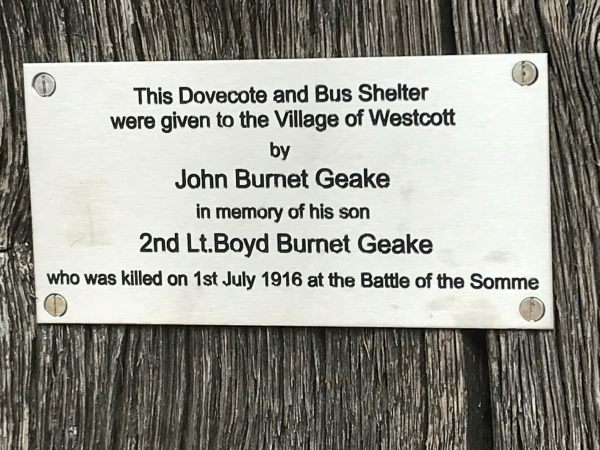 The Footbridge: Bus shelter and dovecote dedication plaque.