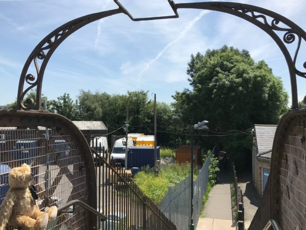 Thr Footbridge: The other side of the bridge, leading to a footpath.