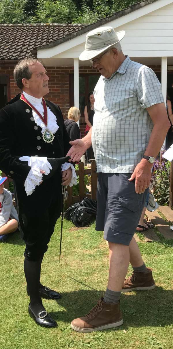 The High Sheriff of Surrey meets Bobby Ballcock on the grass playing field at Westcott.
