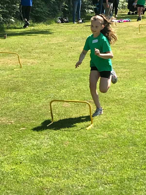Running on grass. Kyla at school sports day.