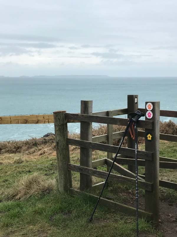 Walk from St David's: Walking poles are very handy. Skomer Island, across St Brides Bay.