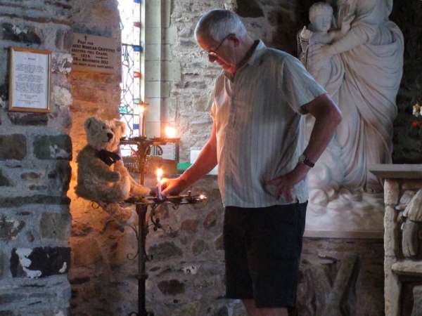 Tick tock. Lighting a candle in St Non’s Chapel, St Davids, Pembrokeshire.