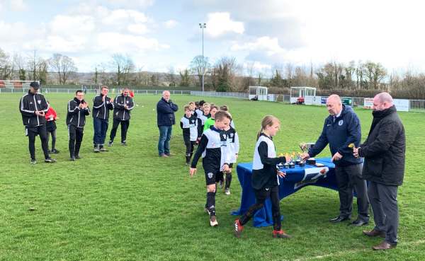 We Won the Cup: The team collecting their medals.