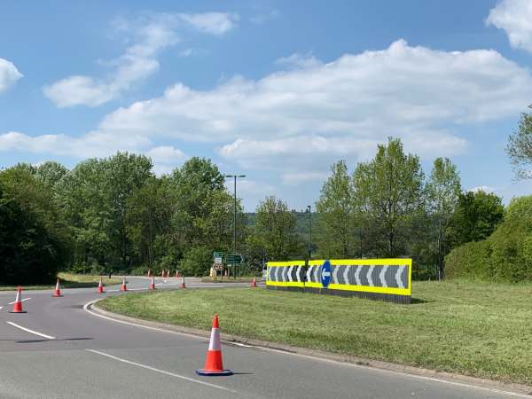 Roundabout devoid of all the wild flowers. Freshly mown and coned off.