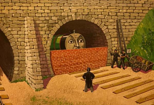Henry bricked up in the tunnel, but able to see over the wall.