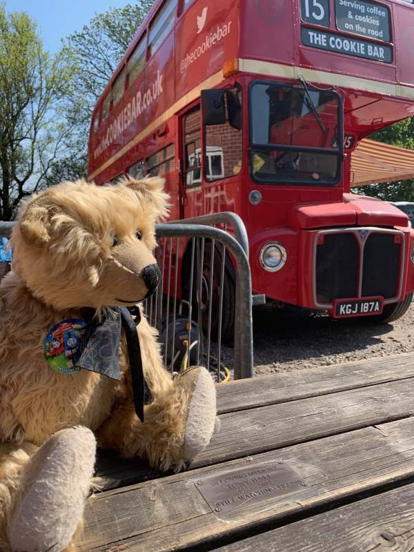 Me sat on Bobby's brother's tribute ppicnic bench and a Routemaster café.