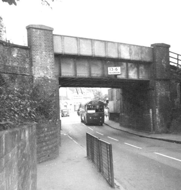 Worcester Park railway bridge as it was with a 213 RF just coming under it.