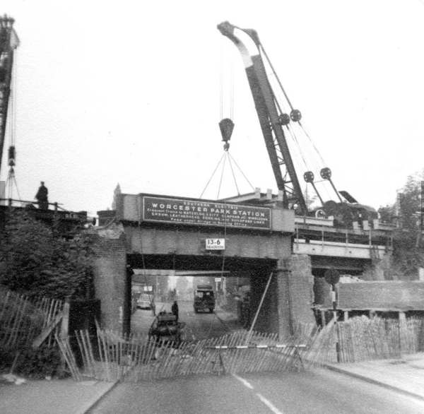 Demolishing the old Worcester Park Bridge.