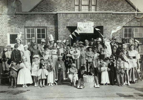 Brocks Drive, North Cheam. Coronation fancy dress party. See the Coronation Clown top left. See the king in the middle front. Bob and Alan. And Chris somewhere in there. This picture appeared on a local group Facebook page recently. Bob, Chris and Alan met in Brocks Drive last year as a result of this picture and are now firm friends.