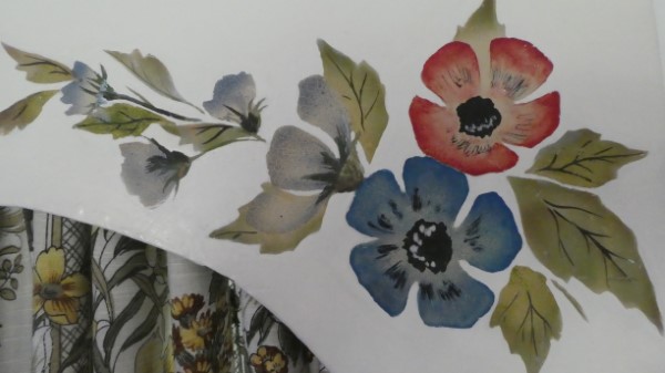 Close-up of embroidered flowers on pelmet decoration.