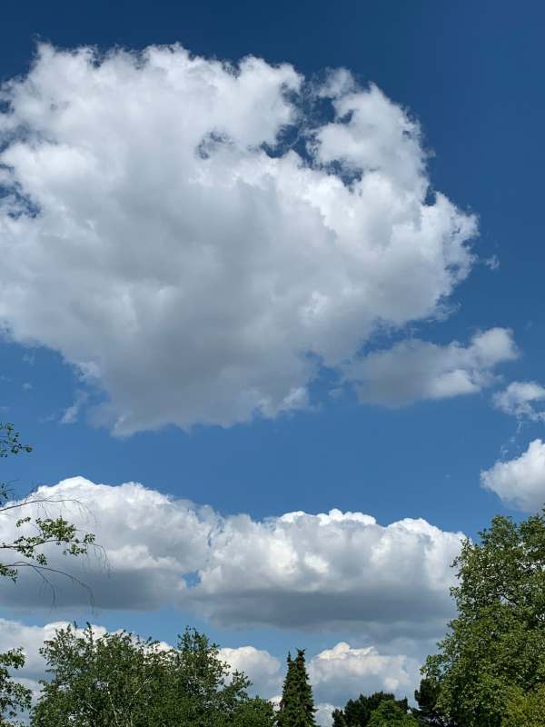 Large white clouds in an otherwise deep blue sky.