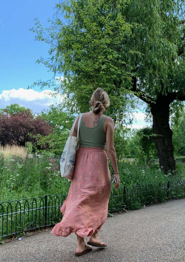 Photograph of a young lady walking by.