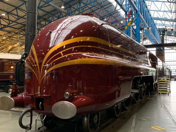 Duchess of Hamilton. A beautiful maroon streamlined steam engine, with yellow/gold "cats' whiskers" painted for effect. The front is rounded.