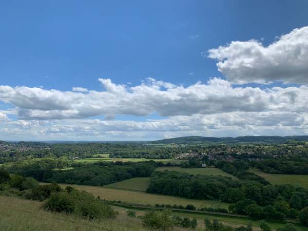 Looking south across the Weald. Small gap, two thirds to the right, is Leith Hill. You can see the Tower. The hill heading down to the middle of the picture is Redlands. At the foot lies South Holmwood and Laurel Cottage. Far beyond is the South Downs, towards Chanctonbury Ring.