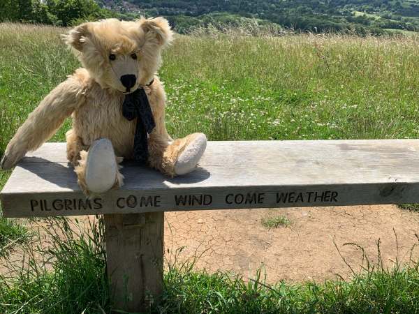 Close up of the inscription on the bench "Pilgrims come wind come weather".