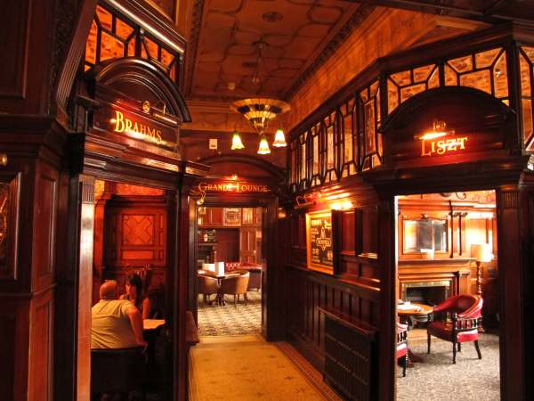 Inside the "Phil". Three doorways named "Brahms", "Liszt" and "Grande Lounge".