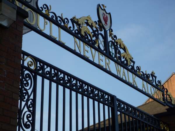 "You'll never walk alone" in the ironwork of the gates at Liverpool Football Club.