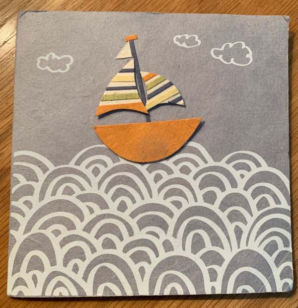 Card featuring an artistic yacht on a sea.