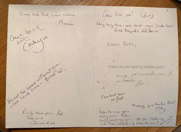 The inside of the Get Well Soon card, with various hand-written messages to Bob from colleagues.