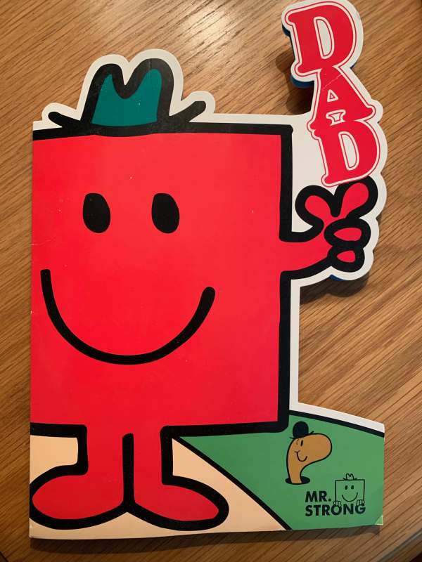 A "Mr Men" card. Mr Strong, with the word "DAD" standing vertically on his left hand. The card is cut around around the general shape.