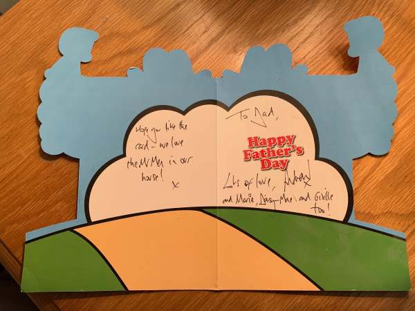 The inside of the card, addressed to Bob on Fathers' Day. The cut-out now resembles the shape of a muscle man flexing with his arms raised.