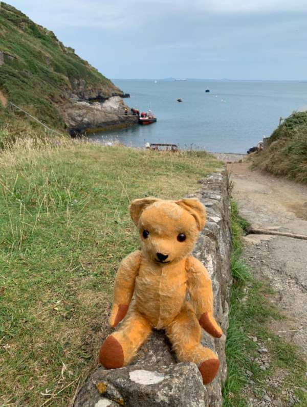 Eamonn posing at Martin's Haven, with the sea behind him.