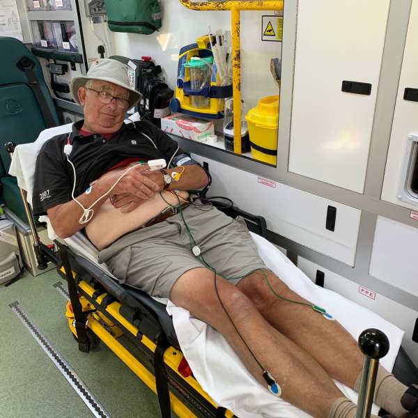 Bobby on the trolley in the ambulance. All wired up to monitors.