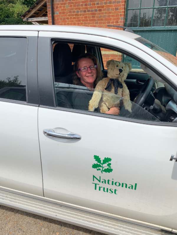 Bertie sat on Amanda's lap in the car/truck.