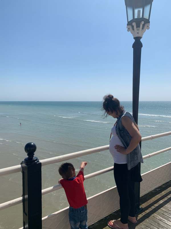 Jasmine and Little Jay looking out to sea from Worthing Pier.