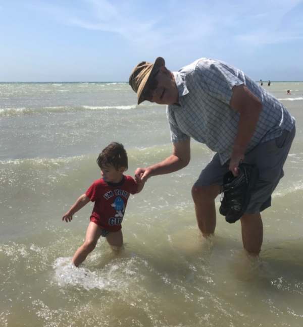 Little Jay (left) and Bobby (right, holding his shoes) paddling - 