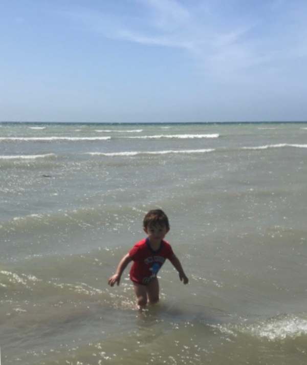 Little Jay playing in the sea at Worthing.