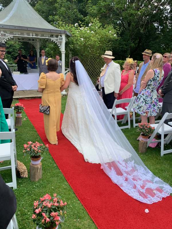 A very long wedding train on the bride.