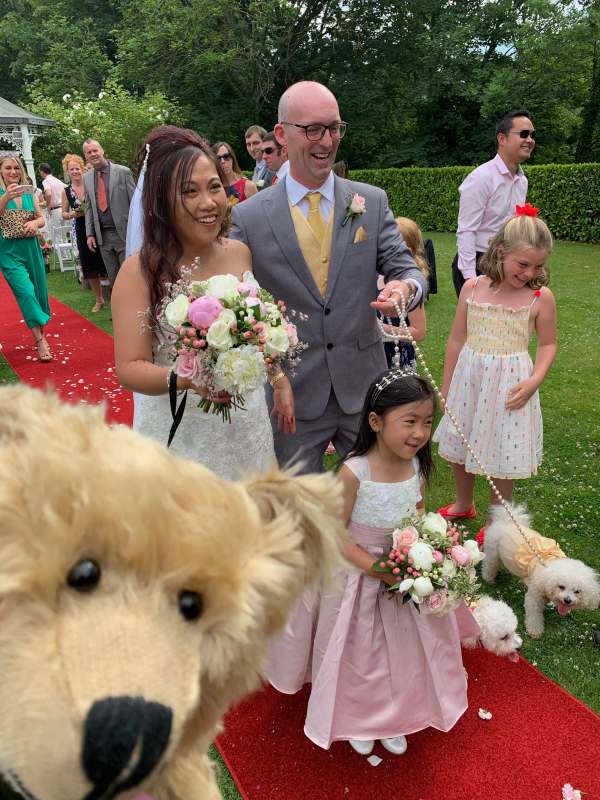 Bertie in front ot the bride and groom and whole family.