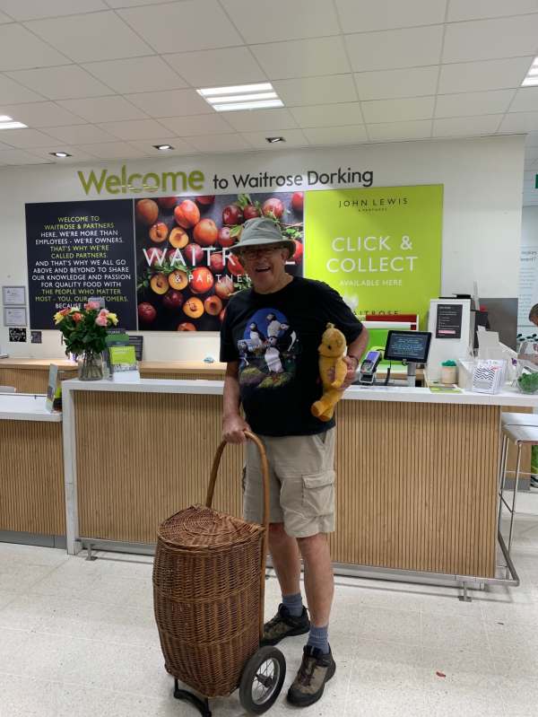 Discombobulated: Bobby, with Eamonn under his left arm and his right hand on the Shopping Trolley 'Bobby 2' in Waitrose, Dorking.