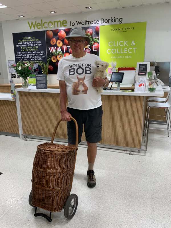 Discombobulated: Bobby, with Trevor under his left arm and his right hand on the Shopping Trolley 'Bobby 2' in Waitrose, Dorking.