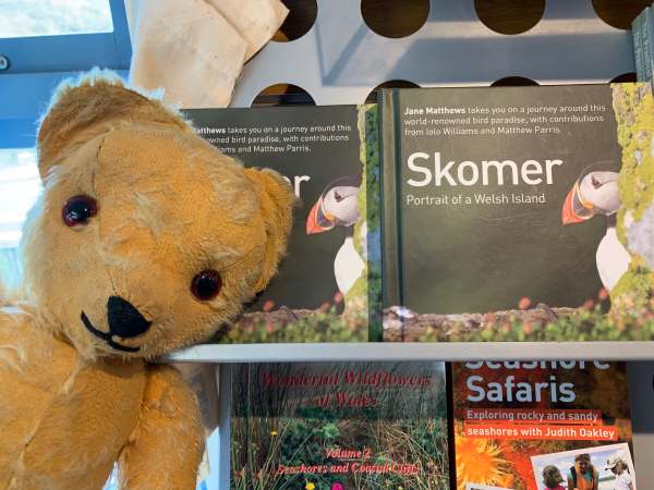 Eamonn in front of some books, including one on Skomer.