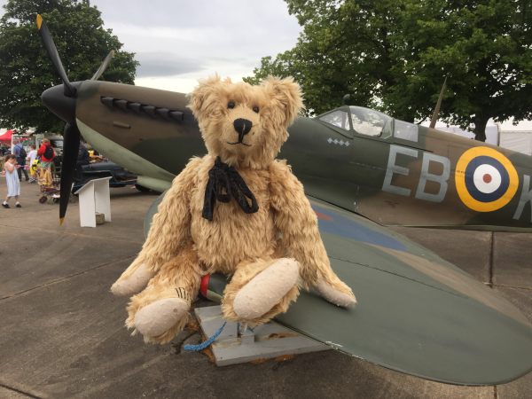 Bertie sitting on the wing of a Spitfire. Duxford. Last day of summer, 2016.