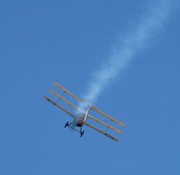 Rear view of a Sopwith Triplane, faking smoke at Duxford Airshow 2019.