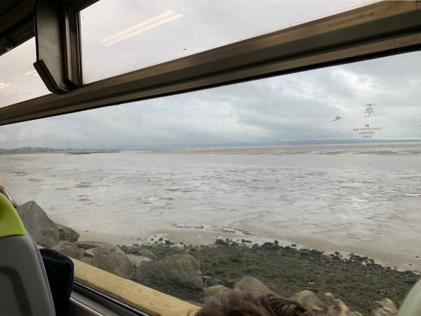 The Burry Inlet near Llanelli. Great windows in a Sprinter. Just two carriages.