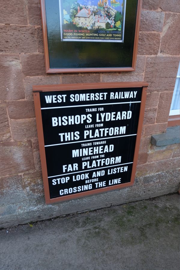 West Somerset Railway station sign. Trains to Bishops Lydeard This Platform; Trains to Minehead Far Platform.