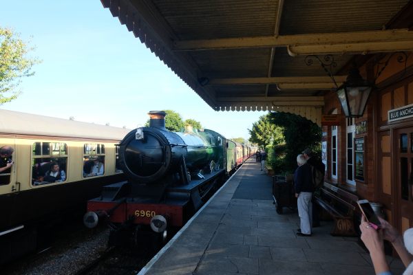 West Somerset Railway - Blue Anchor Station, with 6960 Raveningham Hall pulling in, alongside another train on the opposite platform.