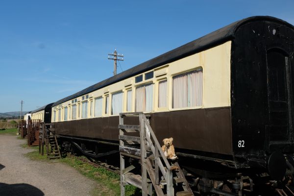 West Somerset Railway - Bertie on a set of steps up to one of two coaches used as accommodation for volunteers.