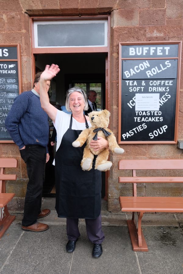 West Somerset Railway - The lady of the café at Stogumber holding Bertie and waving.