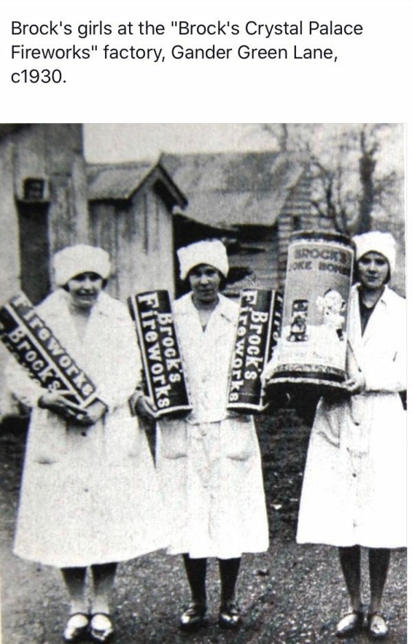 Three female workers holding up some massive fireworks at the Brocks Factory in the 1930s.