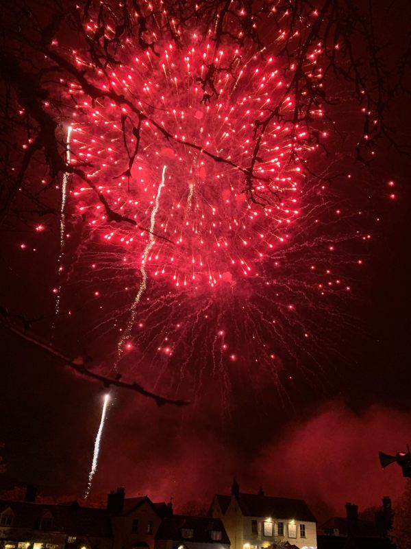 Deep red fireworks over Brockham.