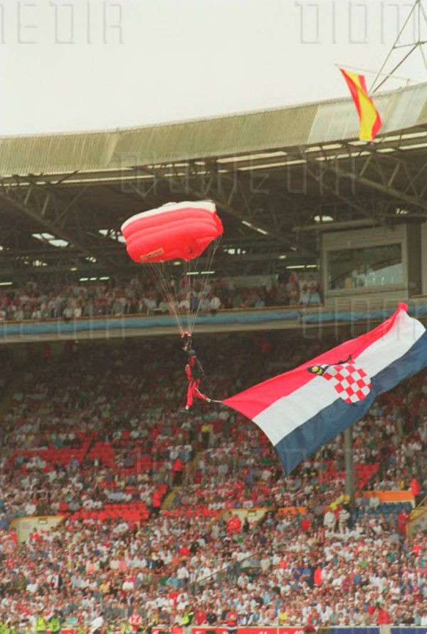 Flags being parachuted in to the stadium.