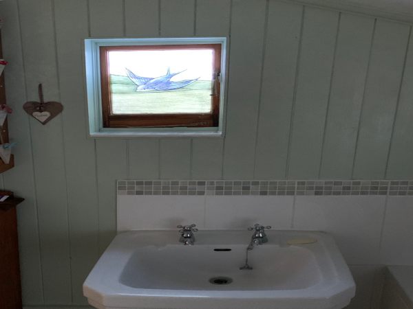 The sink in Bobby's bathroom, under the Bluebird window.