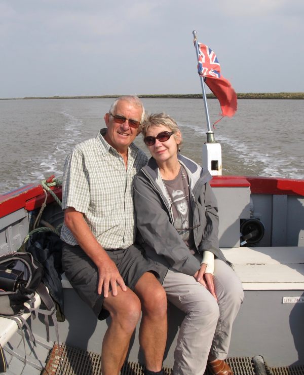 Bobby & Diddley on the back of a small trip boat on the River Orford.